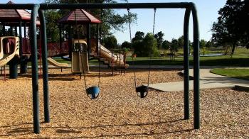 Children Swings Moving In Empty Playground At Park Stock Video ...