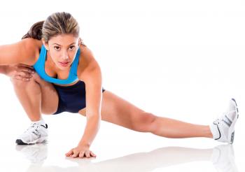 exercising woman in side stretch,