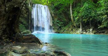 Amazing nature of evergreen rainforest. Beautiful waterfall falls to ...