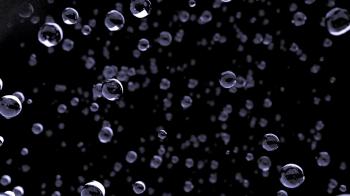 Rain water droplets close up falling away from camera DOF slow ...