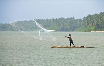 Fisherman cast net