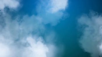 High definition animated background loop of white fluffy clouds ...