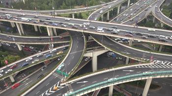 Cars drive across an impressive flyover in Shanghai, China Stock ...