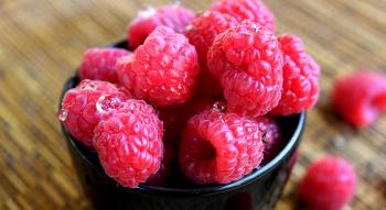 Fresh raspberries with water drops