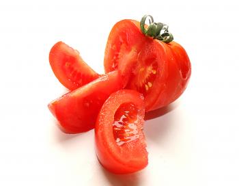Fresh sliced tomato isolated on white