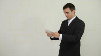 Funny businessman playing game on digital tablet Stock Video Footage ...