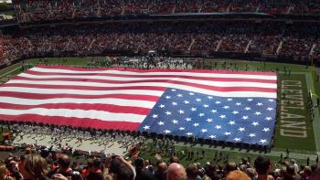 Rookie QB gets trapped under a giant American flag