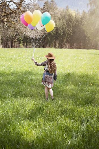 Girl holding Balloons