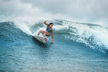 BALI'S PIONEERING GIRL SURFER, DIAH RAHAYU, RE-SIGNS WITH RIP CURL