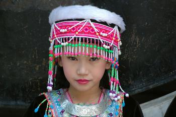 Girl Wearing Pink and Green Beaded Cap