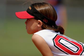 Girl Wearing Red and Black Sun Visor and White and Red Jersey Top