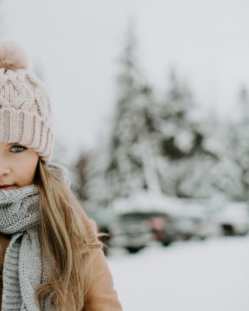 Girl Wearing Winter Outfit on Snowy Field