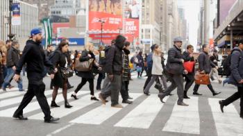 people going to work in the morning crossing street in the city ...