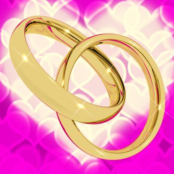 Gold Rings On Pink Heart Bokeh Background Representing Love Valentine