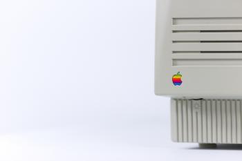 Gray Device With Apple Logo on White Surface