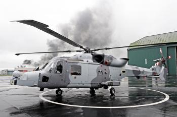 Gray and white helicopter near green storage house HD wallpaper ...
