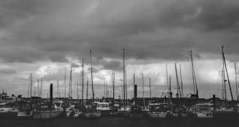 Gray Scale Photo of Group of Boats