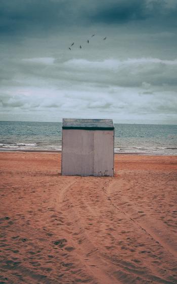 Gray Storage Shed on Brown Sand