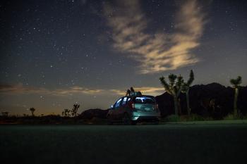 Gray Suv Under Blue Starry Sky during Nighttime