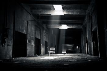 Grayscale Photo of Chair Inside the Establishment