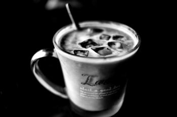 Grayscale Photo of Cup With Ice Cubes