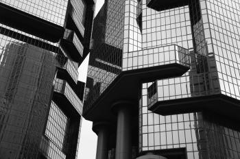 Grayscale Photo of Glass Building
