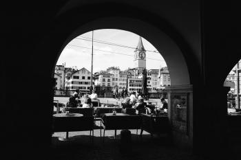Grayscale Photo Of People In A Cafe