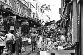 Grayscale Photo of People in the Market