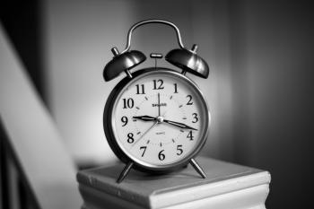 Grayscale Photo of Twin Bell Alarm Clock