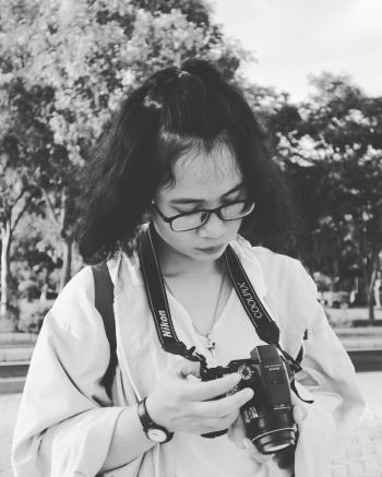 Grayscale Photo of Woman Holding Black Nikon Coolpix Dslr Camera