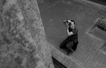 Grayscale Photography of Man Taking Picture