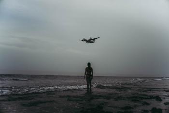 Grayscale Photography Of Woman On Seashore