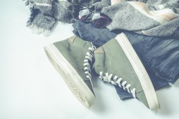Green High-top Sneakers Beside Bottoms And Sunglasses