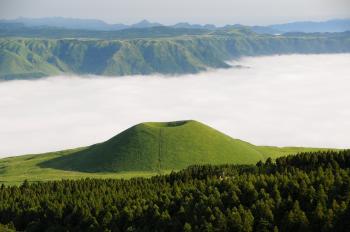 Green Mountain in Front of White Clouds