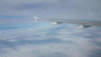 A dreamlike view from a jet airplane window flying over enigmatic ...