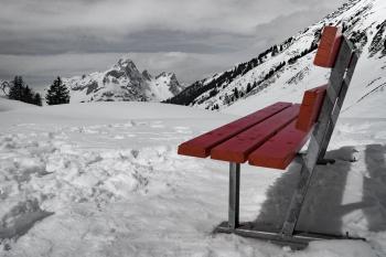 Grey and Brown Bench on Snow Near Mountain during Daytime