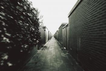 Grey Scale Photography of a Corridor