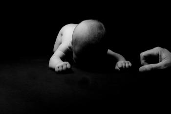 Greyscale Photo of a Baby Crawling