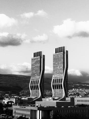 Greyscale Photography of Two High Rise Buildings