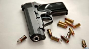 gun-with-bullets - Douglas Crawford Law
