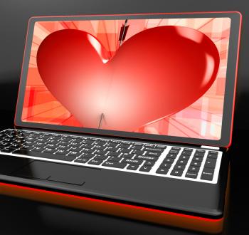 Heart On Laptop Showing Cupid Shot