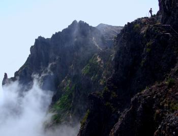 Hiker silhouette near the precipice