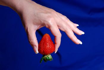 Holding a strawberry