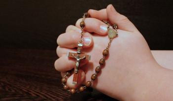 Holding String of Beads, Praying to God