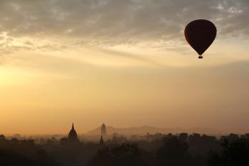 Hot Air Balloon and City Silhouette during Daytime
