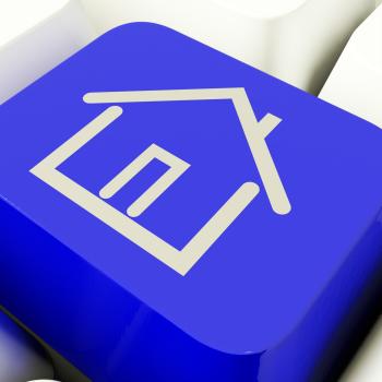 House Symbol Computer Key In Blue Showing Real Estate Or Rentals
