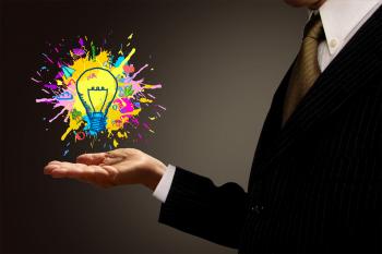 Ideas at Hand - Businessman and Painted Lightbulb