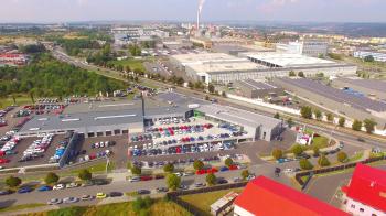 Camera flight over industrial area and construction site on suburb ...