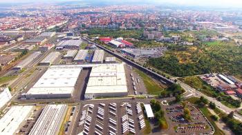 Camera flight over industrial area and construction site on suburb ...