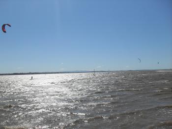 Kitesurfers and windsurfers